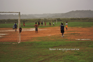 football against a backdrop of mountains and fields
