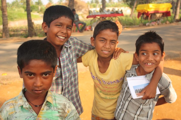 Four friends selling knick-knacks outside the sites %22Holiday!%22 they screamed when I asked why they weren't at school.