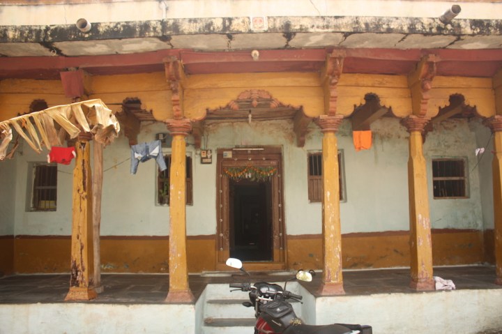 Houses in Anegudi, with the wooden painted pillars along the front verandah.
